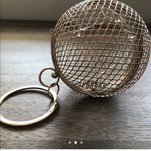 Spherical gold colored clutch/purse